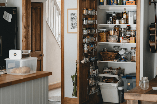 a kitchen with a fully stocked pantry